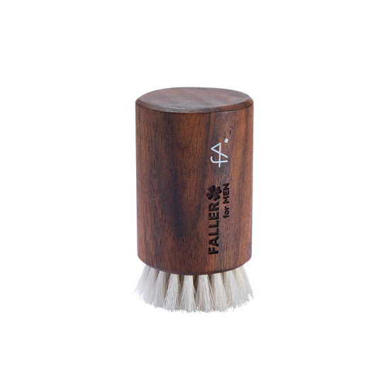 Wooden brush with white bristles  branded 'Faller for Men'.