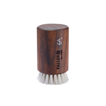 Wooden brush with white bristles  branded 'Faller for Men'.