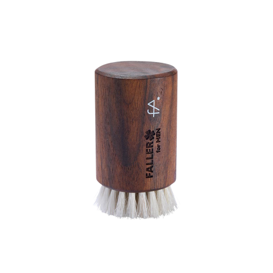 Wooden brush with white bristles  branded 'Faller for Men'.