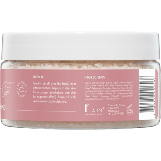 Jar of body scrub with a pink label rosewater + pink clay