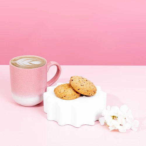 Pink mug with a coffee drink and Lactation vanilla cookies  dairy free and soy free on a pink background 