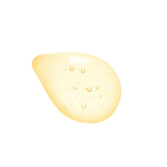 Yellow droplet with bubbles on a white background