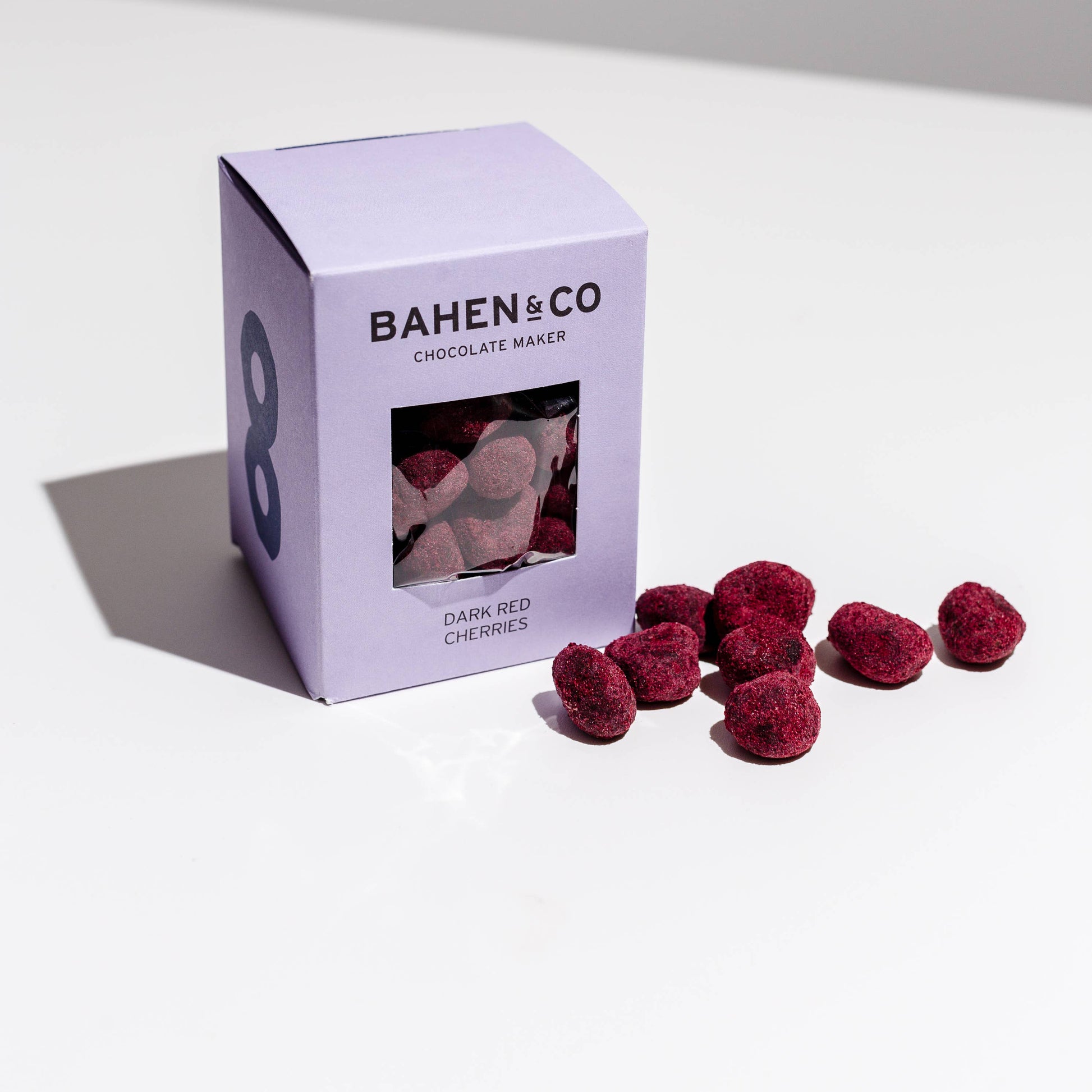Bahlen & Co chocolate packaging with dark red cherries chocolate pieces on a white surface