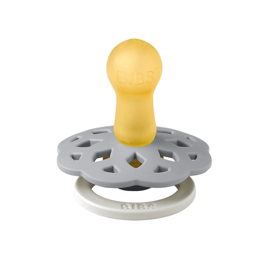 BIBS Boheme pacifier featuring blue color, flower-style silicone shield, and white ring handle—premium baby soothers for newborns and infants. Glow in the dark, round, size one.