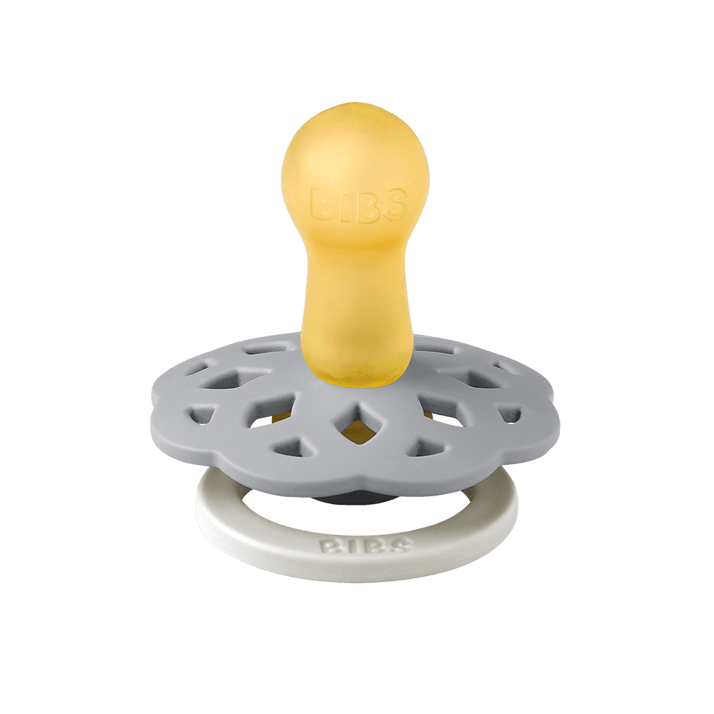 BIBS Boheme pacifier featuring blue color, flower-style silicone shield, and white ring handle—premium baby soothers for newborns and infants. Glow in the dark, round, size one.