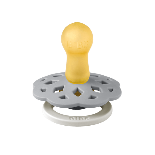 BIBS Boheme pacifier featuring blue color, flower-style silicone shield, and white ring handle—premium baby soothers for newborns and infants. Glow in the dark, round, size one.