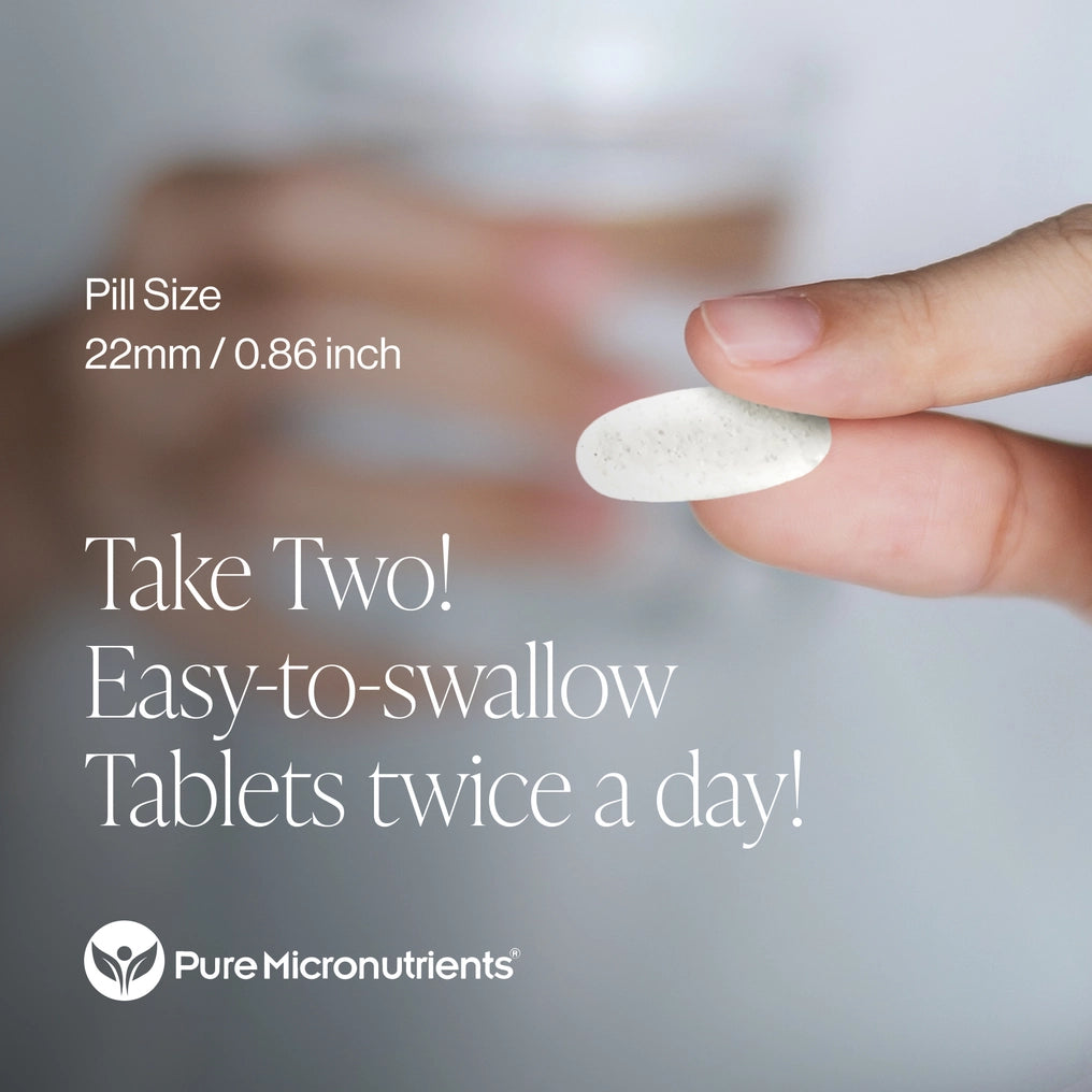 Hand holding a pill with promotional text about easy-to-swallow tablets from Pure Micronutrients.