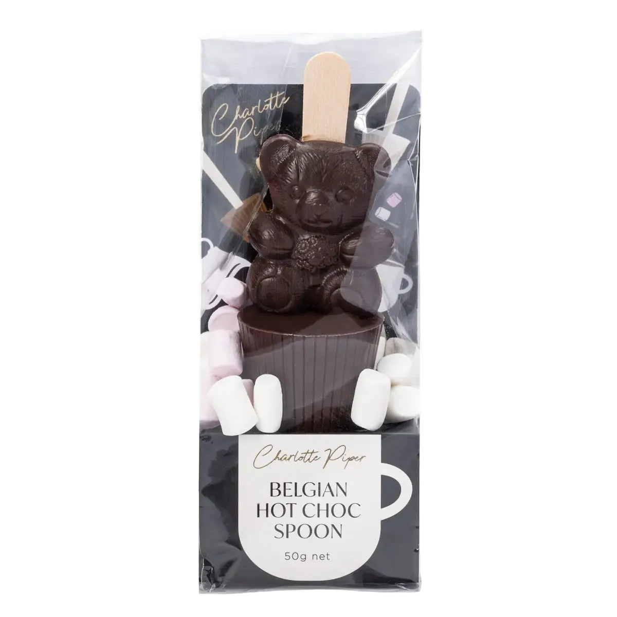 Dark chocolate bear with a hot chocolate spoon and marshmallows in packaging, featuring the brand 'Charlotte Piper'.