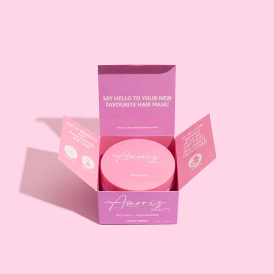 Pink amoris hair mask packaging with 'Amoris Beauty' branding on a pink background