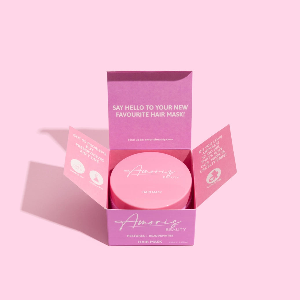 Pink amoris hair mask packaging with 'Amoris Beauty' branding on a pink background