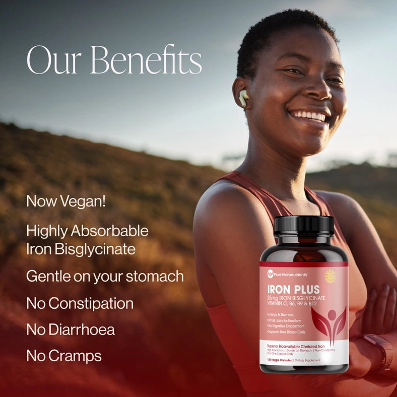 Woman standing behind a bottle of Iron Plus supplement with a scenic background. Our benefits: Now vegan! Highly absorbable Iron bisglycinate. Gentle on your stomach. No constipation. No diarrhoea. No cramps.