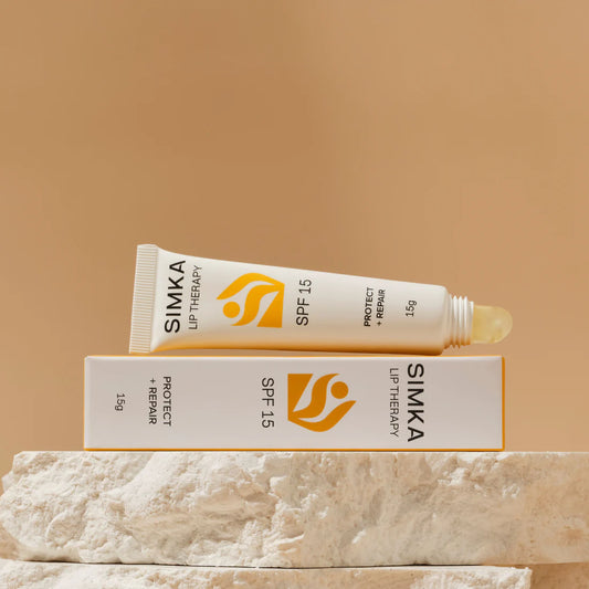 SIMKA lip therapy tube and packaging on a beige background
