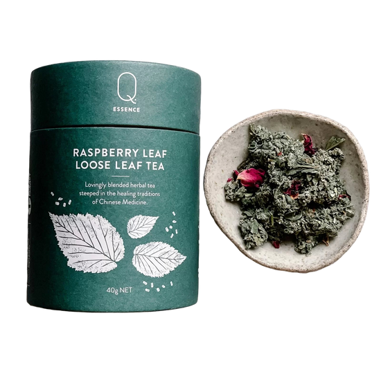 Raspberry loose leaf tea canister 40g . Little bowl of loose tea.