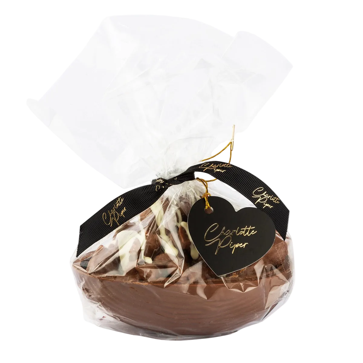 Chocolate egg in clear packaging with a black heart-shaped tag saying charlotte piper